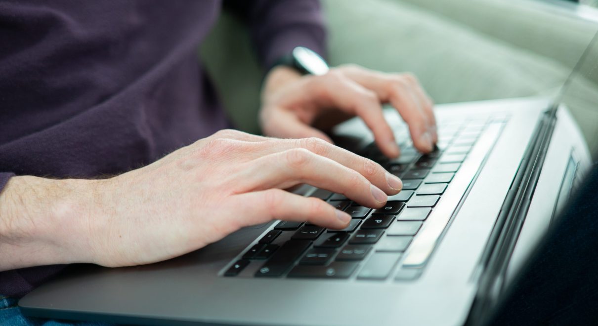 hands laptop featured image scaled.jpg