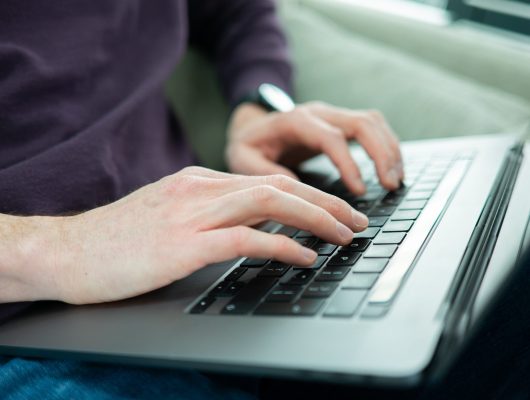 hands laptop featured image scaled.jpg