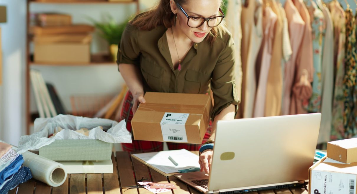 female store owner checking packing online orders ecommerce small.jpg
