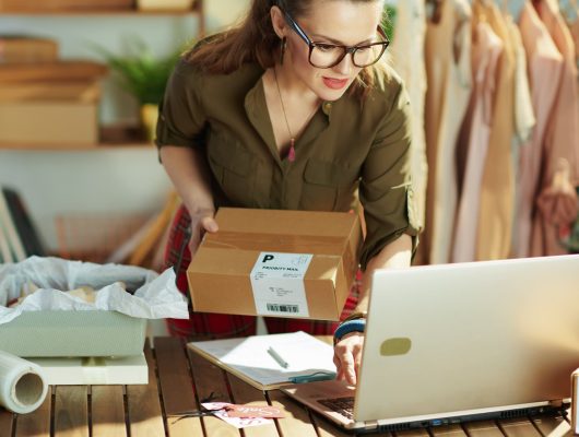 female store owner checking packing online orders ecommerce small.jpg